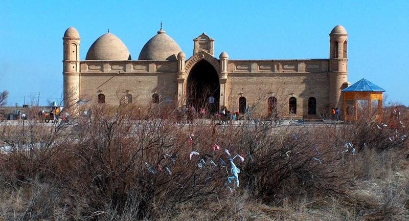 The mausoleum-mosque houses a Quran that tradition and museum records associate with the art of medieval calligraphy.