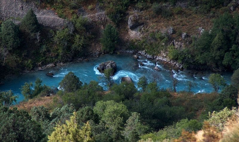 Blue Aksu River flows at bottom of canyon of same name.