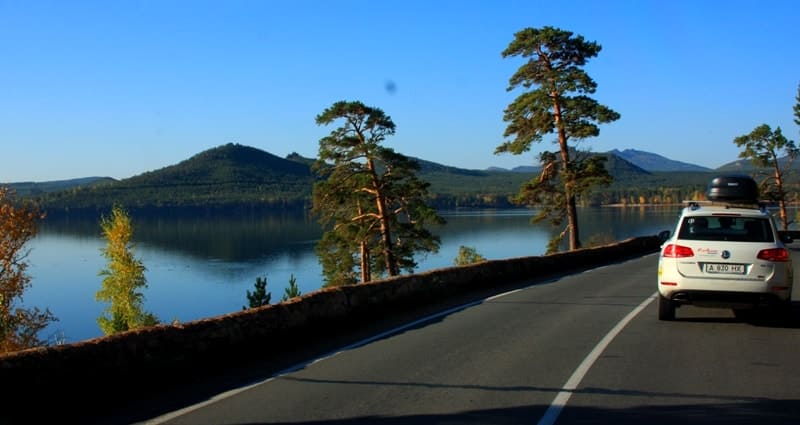 View of Lake Borovoe from the north. On northwestern shore of lake is rocky, mushroom-shaped Zhumbaktas Island and Mount Okzhetpes.
