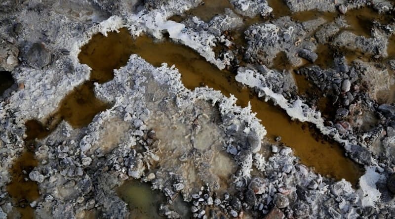 Salt deposits are exposed in numerous karst sinkholes and on right bank of Karkara River.