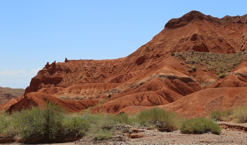 Where earth preserves warmth of ages. In every ledge are traces of prehistoric seas, in every curve, an echo of movement of continents.