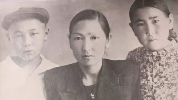 In photo - in center is Nurkamal Zhetikashkaeva. Author of photo is unknown.
