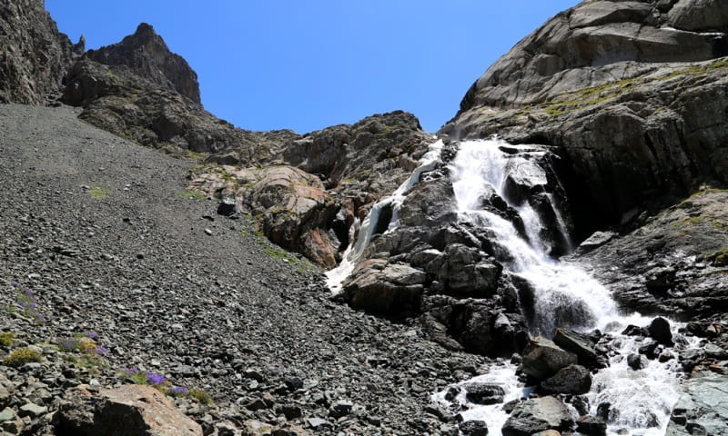 A cascade of waterfalls on the Ala-Kel River in front of the lake of the same name.