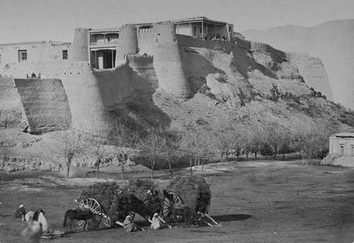 Citadel of the city of Khujand. The photograph was included in the historical section of the "Turkestan Album," created in 1871-1872. The city and its fortress were the site of active military operations during the conquest of Central Asia by the Russian Empire, as well as unrest in 1916. The photograph shows massive adobe walls and Fortress towers on a hill, typical of Central Asian fortifications of that period