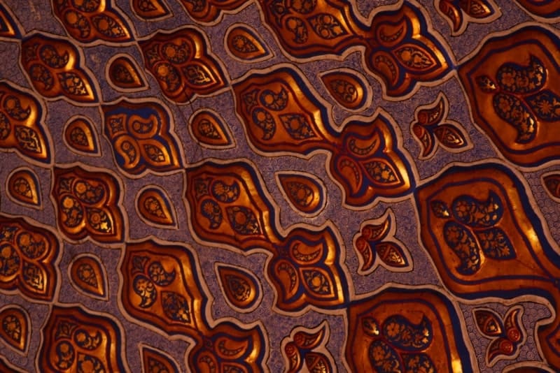 Gilded paintings on the walls inside the Gur-Emir Mausoleum.