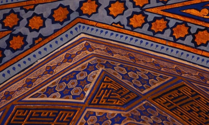 Gilded paintings on the walls inside the Gur-Emir Mausoleum.