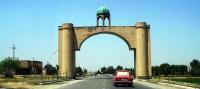 Symbolical arch before entrance to town.