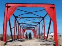 Red bridge in the village of Ekpindy