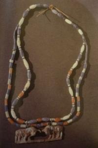 A silver pin in the form of a camel and gold ornament with beads from turquoise and a cornelian and with heads in the form of snakes from Gonur-depe (Margush).