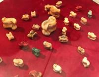 Asyks are the heel bones of sheep or other small cattle used in traditional games. They are used in the Kazakh national game "Asyk atu," which is listed as a UNESCO Intangible Cultural Heritage of Humanity. Animal bones (traditionally) or their imitations made of stone or wood. Asyks are often painted in bright colors for the game. In Kazakh culture, asyk is considered a symbol of good luck and prosperity. The game "asyk atu" is a traditional Kazakh game that has existed since ancient times.