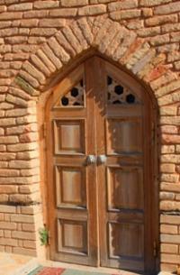 The entrance door to the mausoleum of Okshy ata.