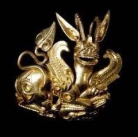 The handle a sword with the image of a griffin. An ivory. A groove, an engraving. 11x4,9 sm