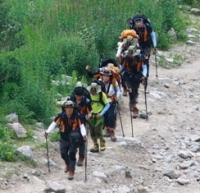 Tourists on route in gorge Small Almaty.