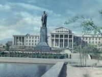Monument to Rudaki on building of Tajik Agrarian University.
