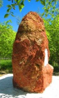 The memorial stone is a symbol of mined bauxite.