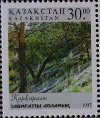На марке изображен национальный парк Каркаралы в Казахстане. Берегите природу.