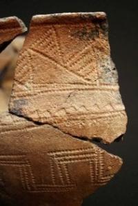 A fragment of a stamped ornament. Andronovo culture, Ser. IItys. BC. Photo from the museum of local lore of Karkaralinsk.