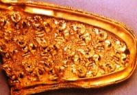 Two cast plates with deer have another image of a flying eagle.